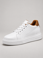 Men's white and brown leather trainers, studio view